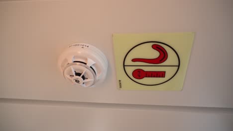 Smoke-detector-with-maritime-sign-in-ceiling-of-passenger-ship