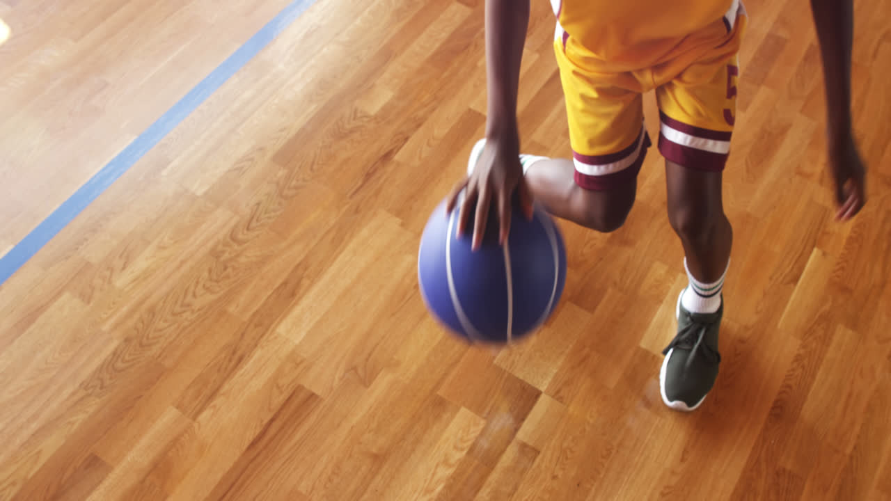 Basketball player practicing dribbling drill
