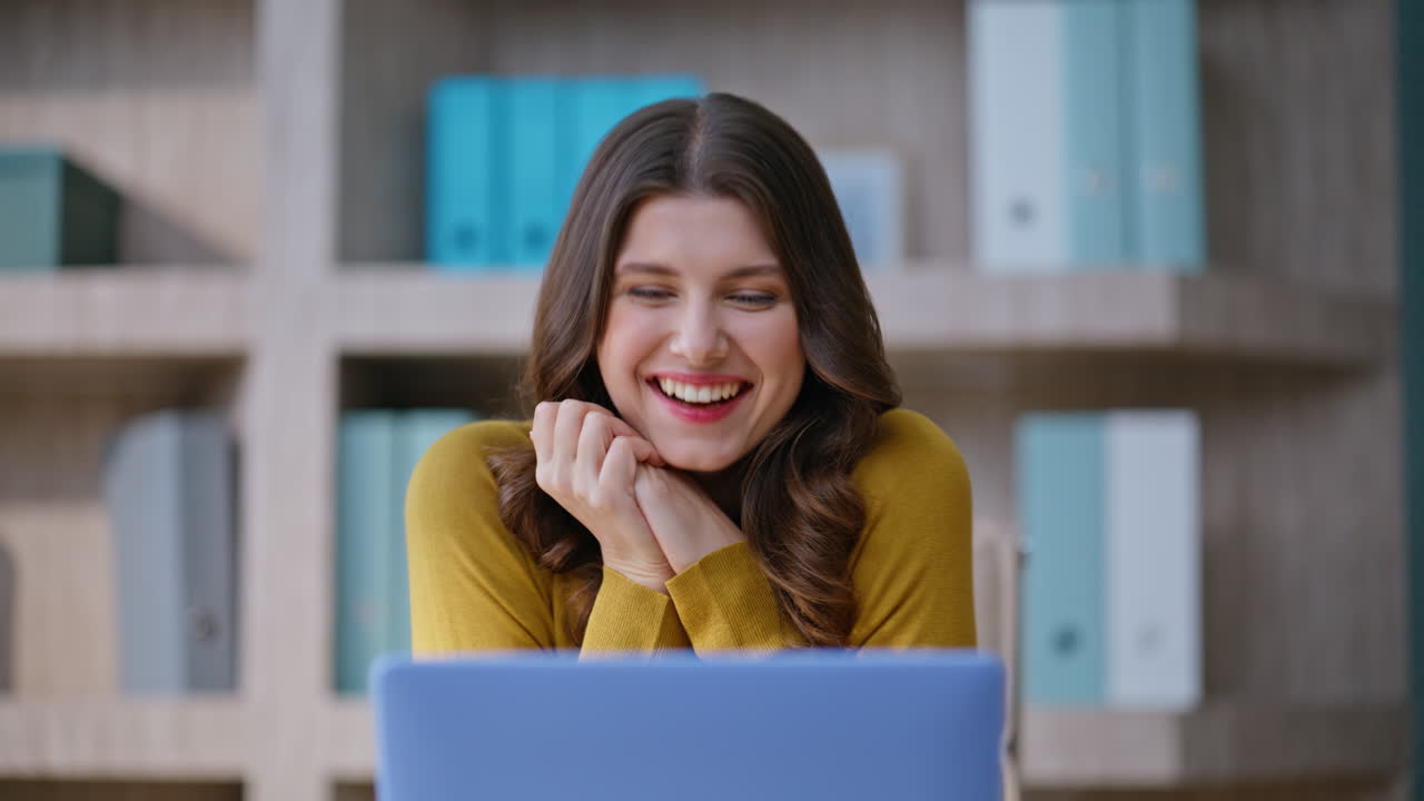 Office worker rejoicing achievement at workplace closeup. Emotional woman