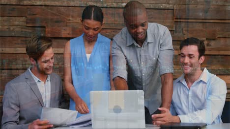 animation of financial data processing over diverse business people using laptop