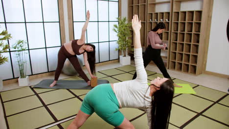 women doing yoga indoors