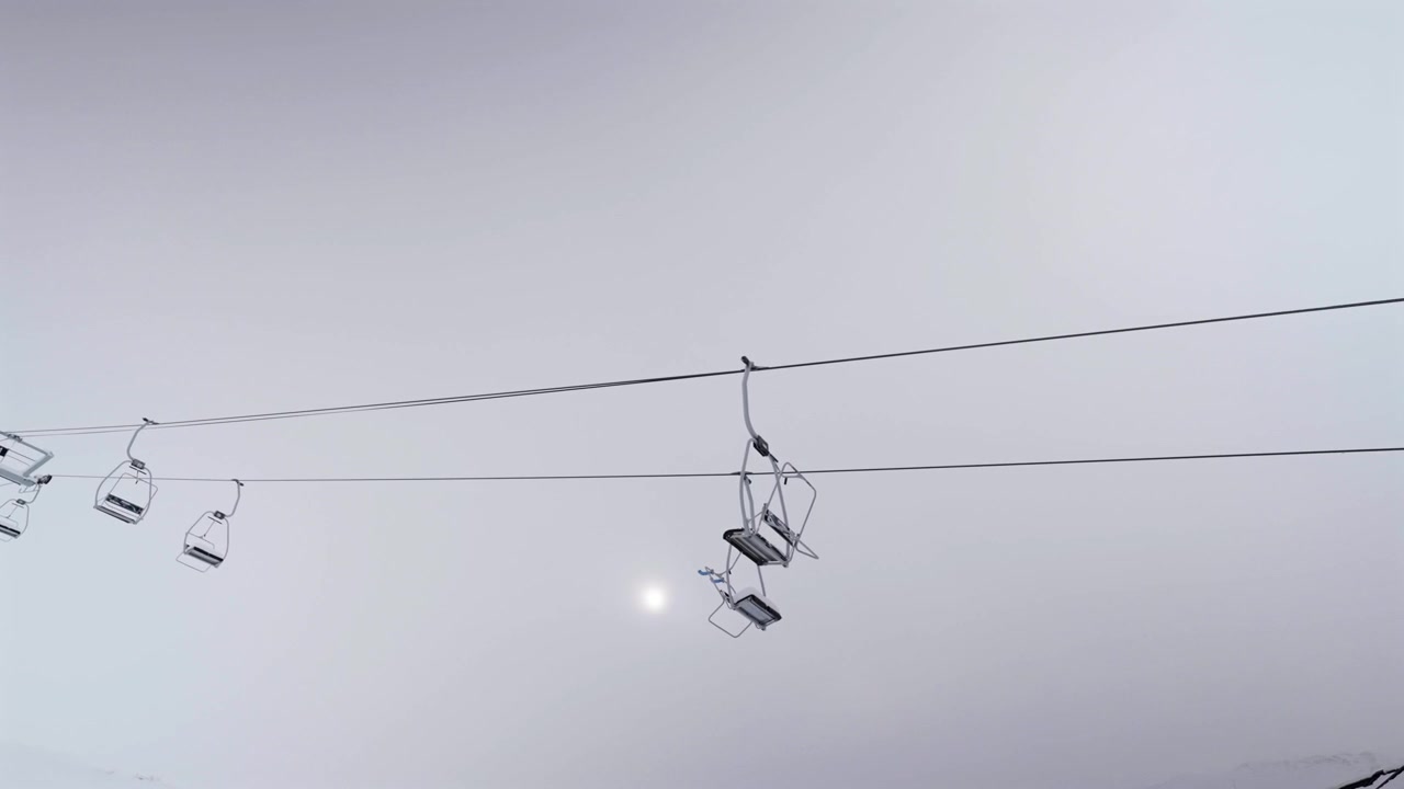 Empty ski chairlifts suspended on cables against a thick, foggy white sky at Las Leñas resort in Argentina. The sun faintly shines through the heavy winter overcast.