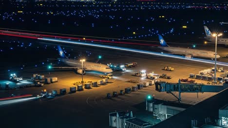 night operations at a bustling airport tarmac
