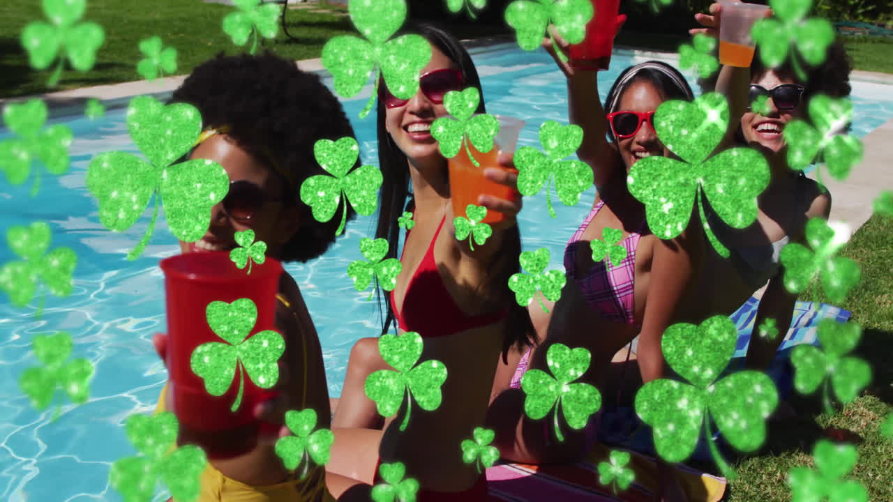 People in swimsuits by pool holding drinks with shamrock animation overlay