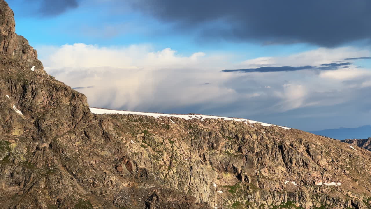 North ridge halfmoon pass trail spring summer Rocky Mountains Colorado blue sky clouds Mount of the Holy Cross wilderness landscape nature view of 14er summit snow field cornice pan left
