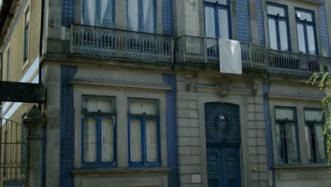 a building in porto with blue frames arond windows and doors.