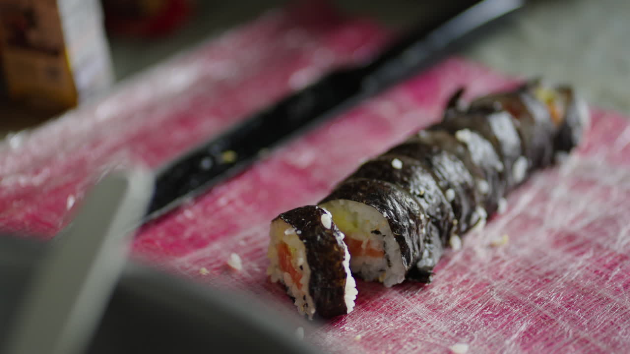 Freshly Sliced Sushi Roll on Cutting Board on Kitchen Counter Close-Up