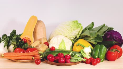 assorted vegetables displayed on a wooden surface