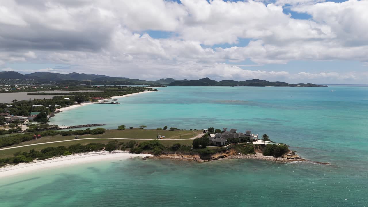 Fort james beach with turquoise waters and coastline in antigua on a sunny day, aerial view