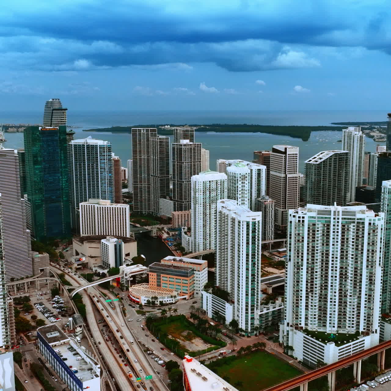 Modern high-rise buildings in the American downtown. Top view of Miami on grey day under overcast sky.