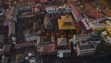 the breathtaking beauty of pashupatinath temple and its surroundings in kathmandu is captured in stunning aerial drone footage during the golden hour before sunset on shivaratri is truly mesmerizing