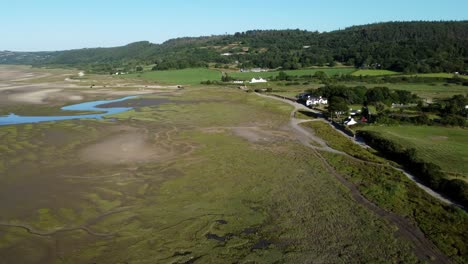 aerial view traeth coch scenic salt marsh moorland countryside at sunset panning left