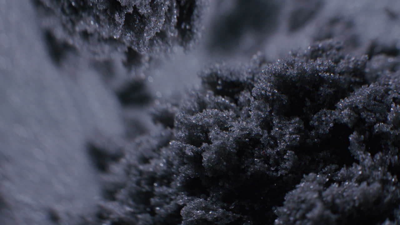 Close-up of dark granular material