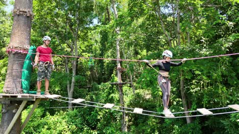 couple enjoying a zipline adventure in a lush forest