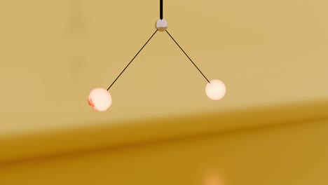 modern ceiling light fixture with two spherical lamps