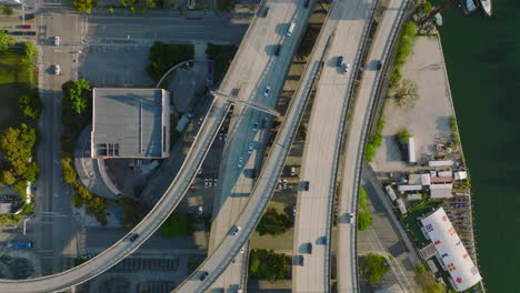 Fly-above-multilevel-and-multilane-highway-interchange-in-city.-Top-down-shot-of-traffic.-Miami,-USA