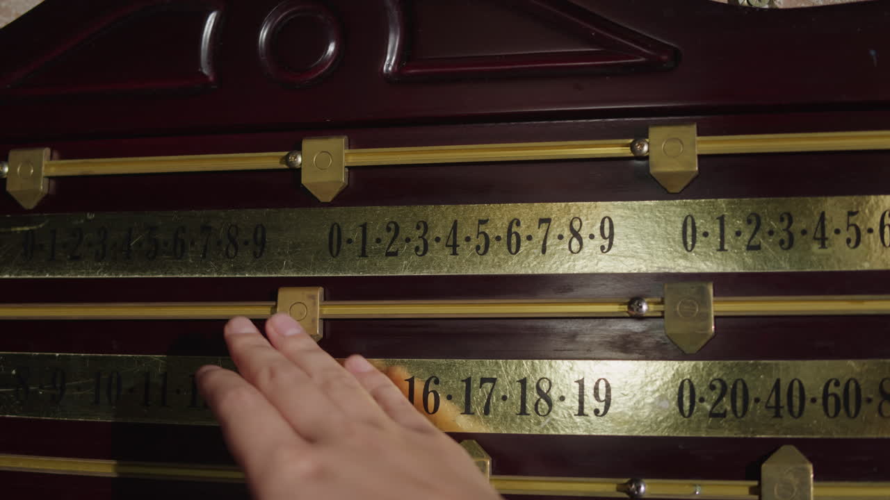 Old scoreboard with a score in billiards. Playing american russian billiard game. High quality 4k footage