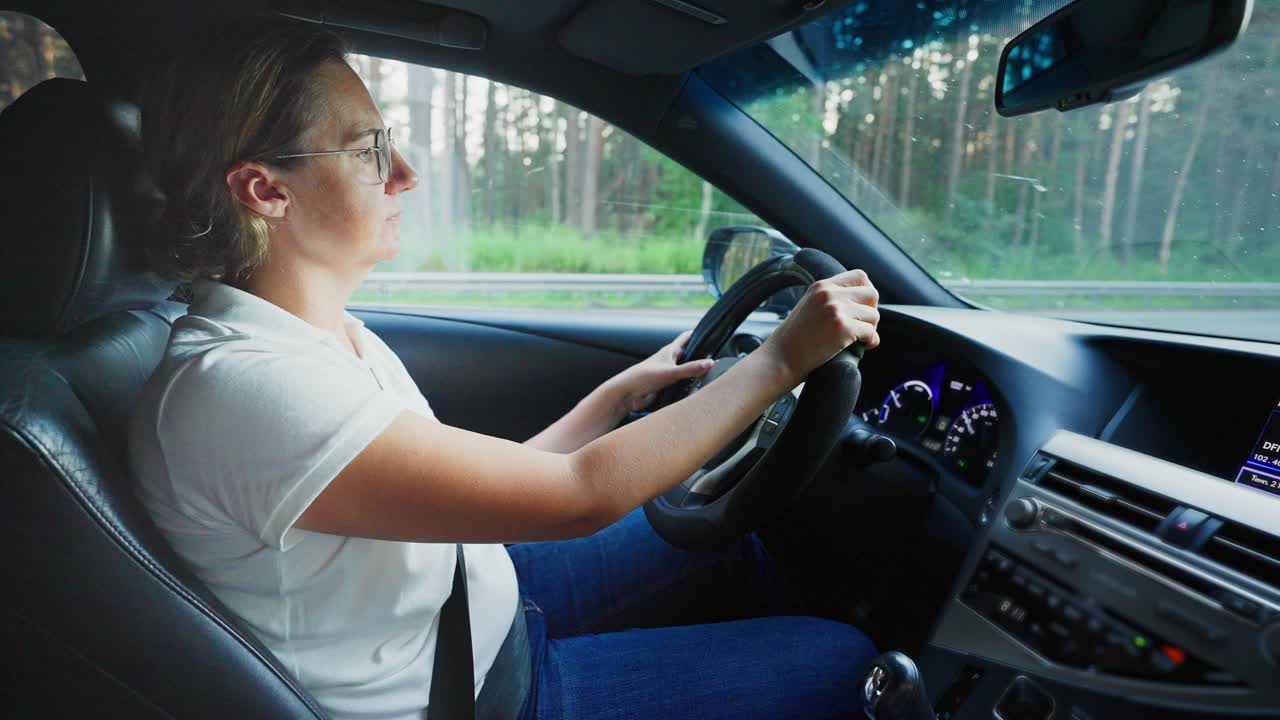 Woman Driving a Car on Highway