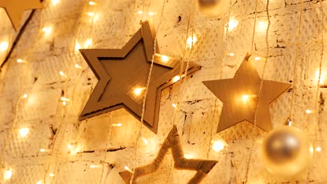 christmas garland with golden lights, close-up. blinking christmas stars lights twinkling. winter holidays concept