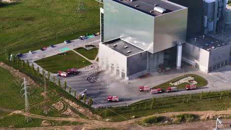 crisis management footage from above kaunas cogeneration plant, where firefighters work during a large incident