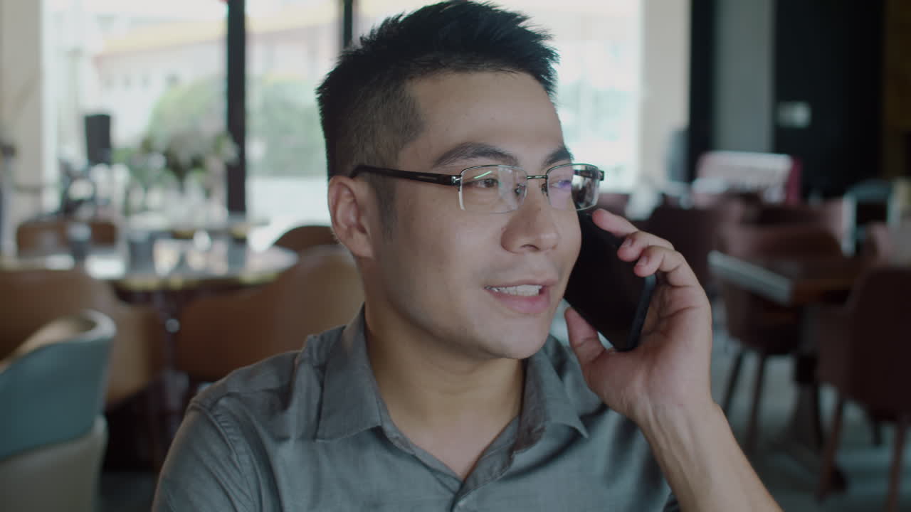 Business Consultant Negotiating with Colleagues on Smartphone