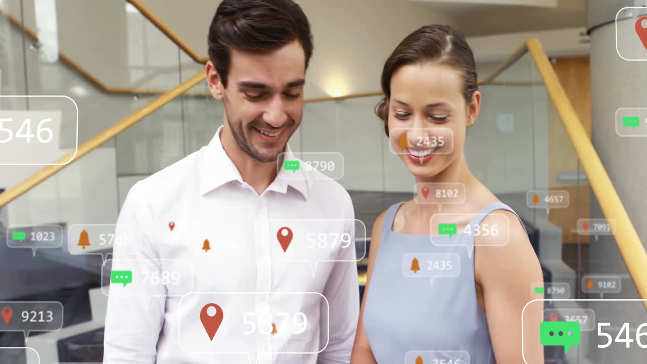 In modern office, animation of social media notifications surrounding smiling couple