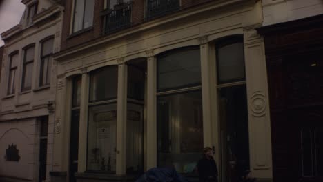 old ijmuiden - netherland - january 21st 2019 : straight down motion view of a classical vintage building on street in dutch neighborhood close to harbor during winter