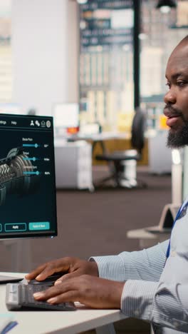 technician using cad software to optimize wind turbine blade aerodynamics