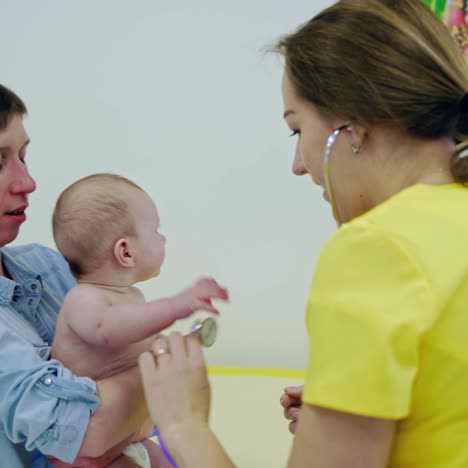 doctor checking up baby