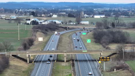 traffic on american highway in rural landscape in winter season