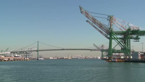 pov shot from a boat of cranes and long beach san pedro harbor scenes 1