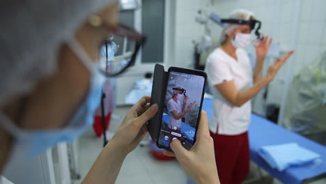 surgeon preparing for operation. close up of ophthalmologist preparing for surgery