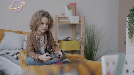 boy playing video games in his bedroom