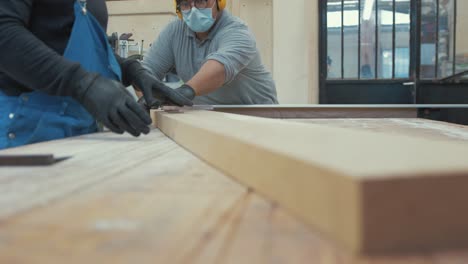 carpenter choosing length of white oak hardwood