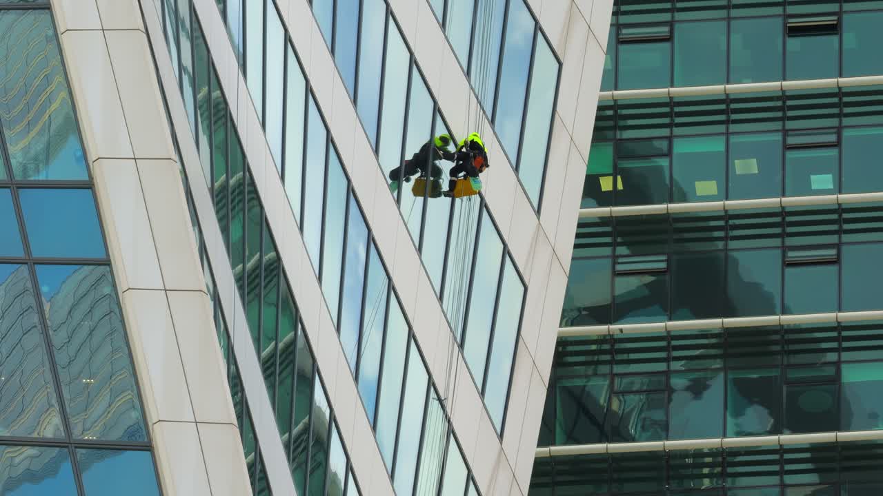Professional Window cleaners at work.