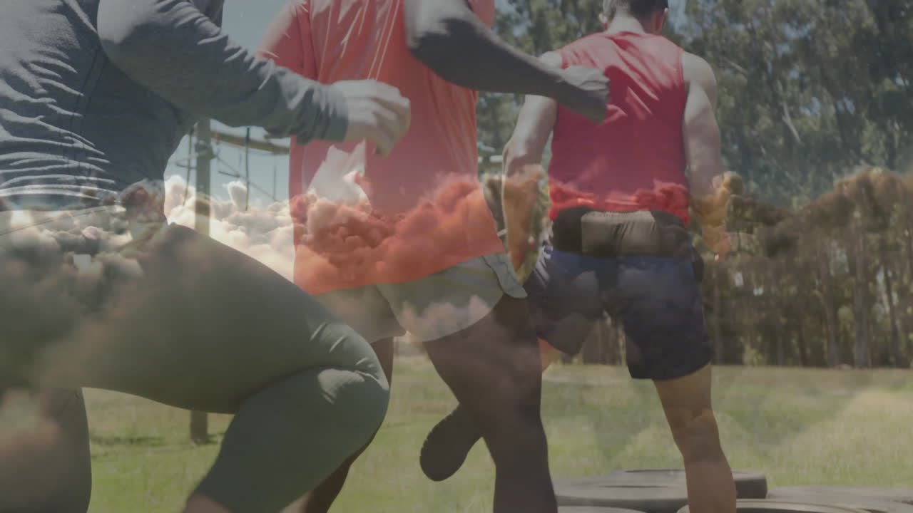 Exercising on tires, people with cloud animation overlay in outdoor setting