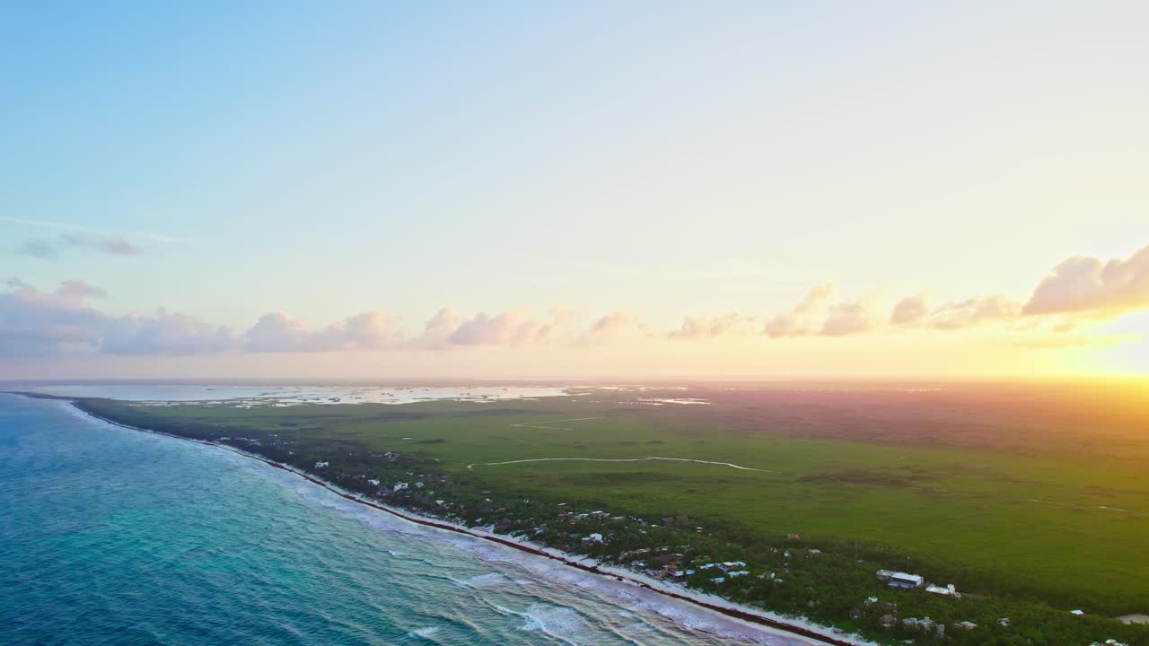 Tulum, Mexico. Wide Aerial Drone Footage Of Beautiful Golden Sunset Setting Behind Yucatan Caribbean Beach,