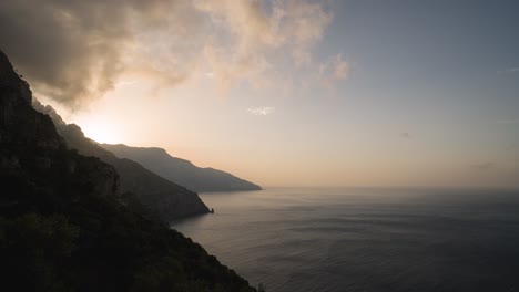 timelapse of the sun coming up over the mountains of the amalfi coastline in italy in 4k