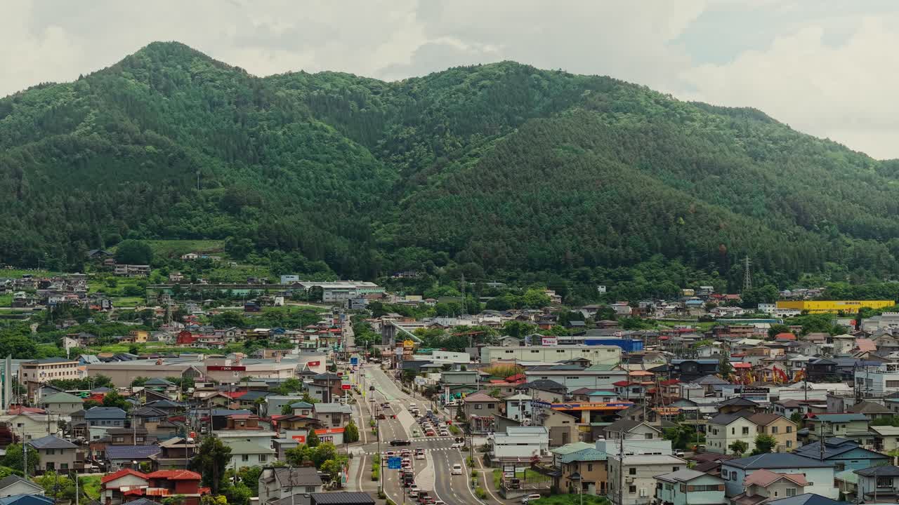 Cityscape with Mountain Backdrop