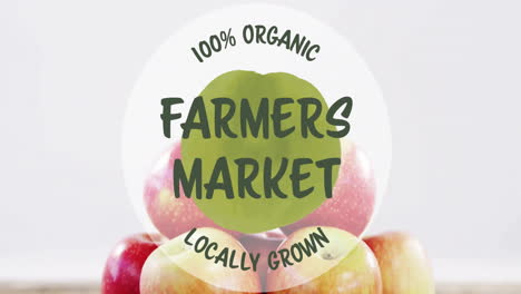 100 percent organic farmers market locally grown text animation over apples