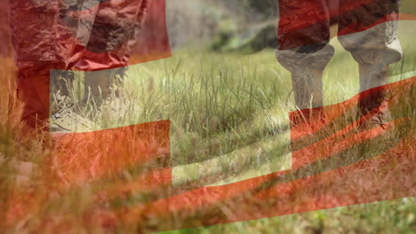 Animation-of-flag-of-switzerland-waving-over-low-section-of-soldiers