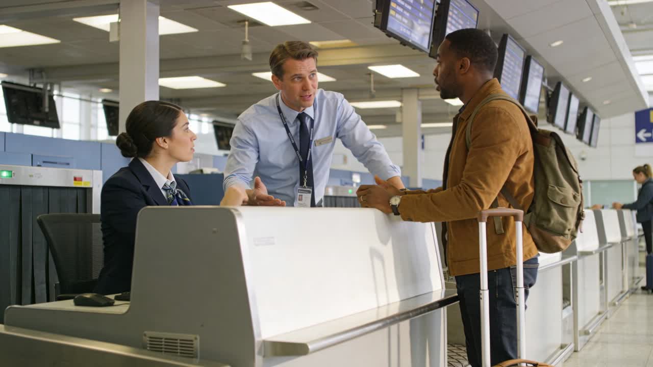 Approaching traveler with suitcase and backpack, receiving directions at check-in, copy space