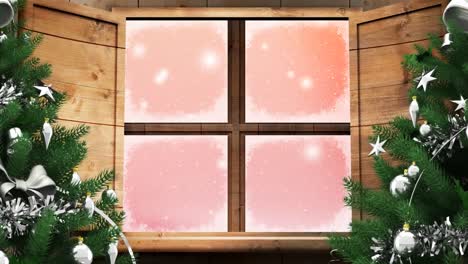 two christmas trees and wooden window frame over snowflakes falling against pink background