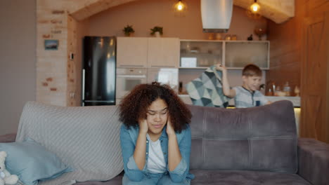 woman stressed by child in house