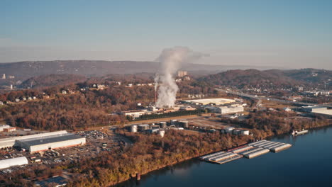 aerial timelapse smoke and steam rising from a factory in the morning in chattanooga tn