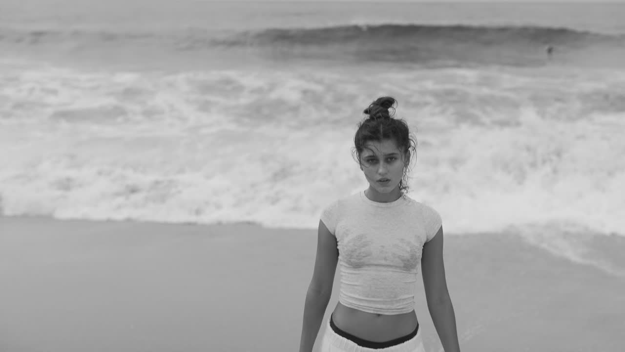 Black and white portrait of a woman on the beach