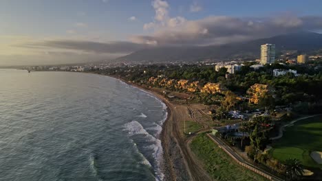 aerial view of urban coastline panning into the sea