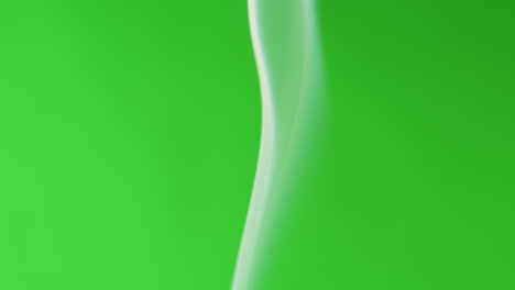 white smoke against a green background