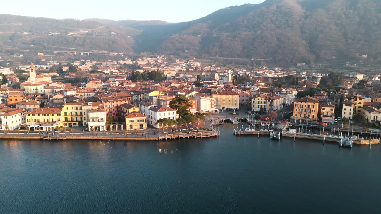 Aerial view city Iseo in Italy during sunset. Small town on Lake Iseo, tourist destination in Italian north in the mountains Alps between Lake Garda and Lake Como.