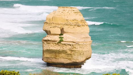 a serene view of the twelve apostles rock formation against turquoise ocean waves under bright daylight